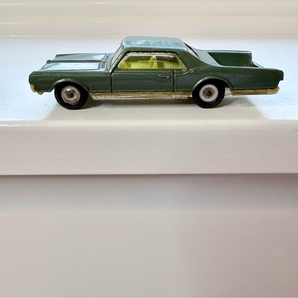 Vintage Husky Oldsmobile Starfire Coupe die-cast toy car rare green